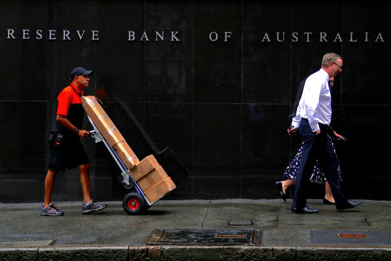 Australia central bank cuts growth outlook, rates need to rise to cool red-hot inflation