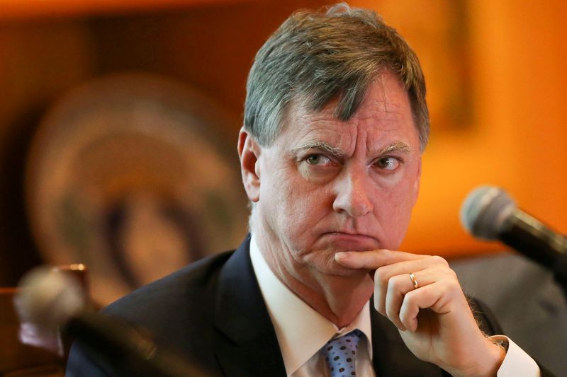 Fed's Evans sees slower rate hike pace, "slightly higher" peak rate