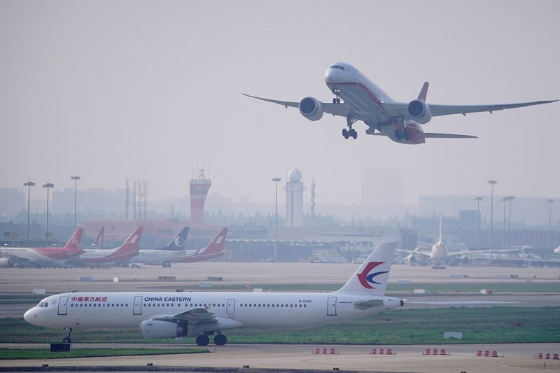 China's top airlines post wider 2021 losses amid drive to stamp out COVID