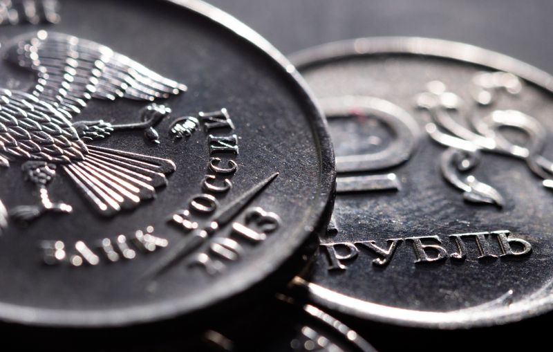 Rouble eases from over 5-week high, Russian stocks climb