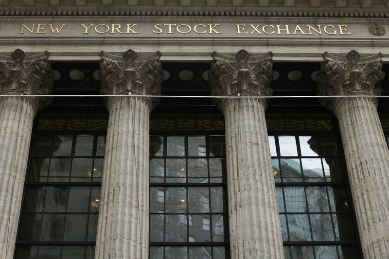 Wall Streets ends down, oil gains as Powell suggests aggressive Fed policy