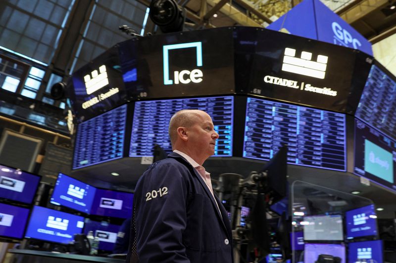 Shares churn, close down; yields fall after U.S. inflation data