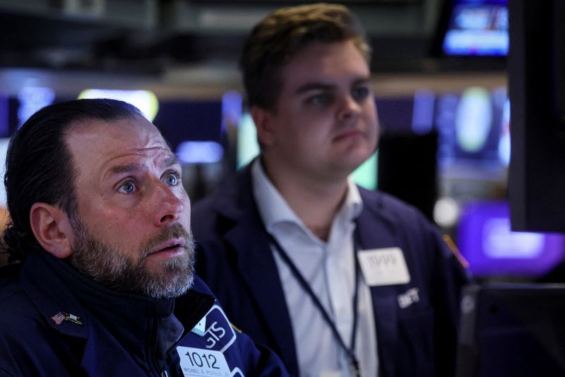Wall Street whipsaws, S&P closes lower on worries of prolonged inflation