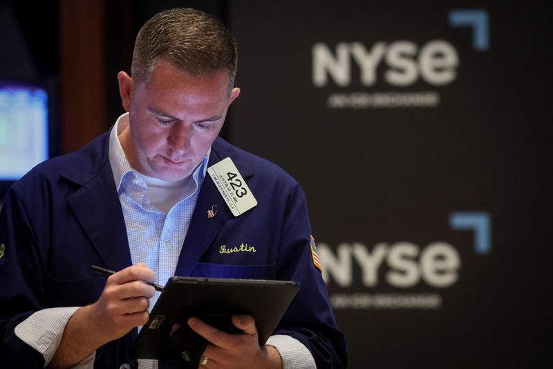 Stocks pummeled by growth worries, U.S. dollar climbs