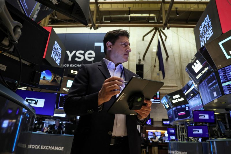 Wall Street sells shares, Treasuries to end fraught February