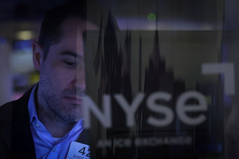 Sliding bank shares drag Wall Street down in choppy trade