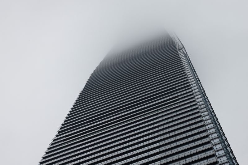 Stunned Credit Suisse staff fear uncertain future despite UBS rescue deal