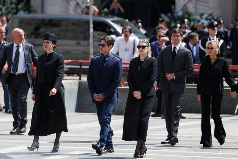 Berlusconi leaves control of business empire to two eldest children