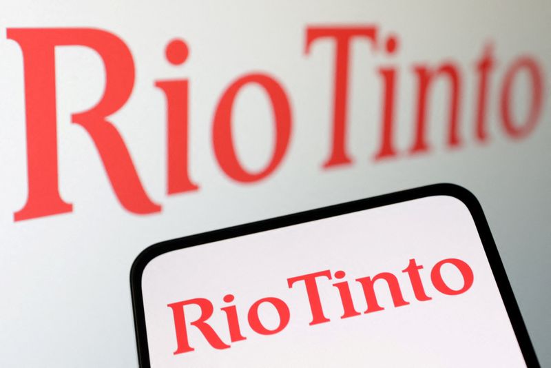 Rio Tinto profit misses on iron ore price slump, cuts dividend
