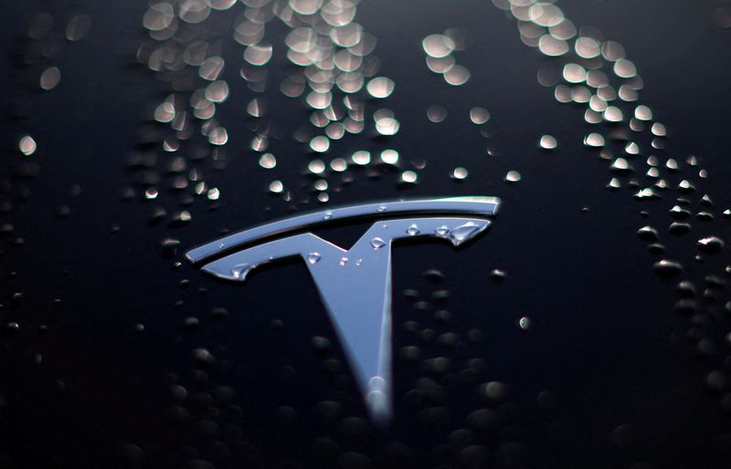 Tesla falls as production cut by battery supplier Panasonic fans EV demand fears