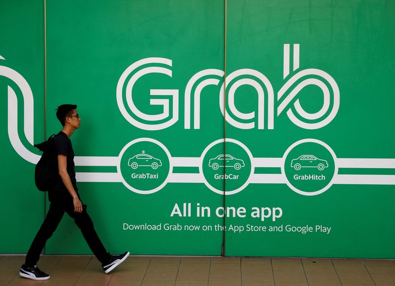 Grab sets free cash flow target, posts first adjusted core profit