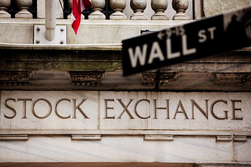 Dow notches first record close in almost two years as Fed signals lower rates