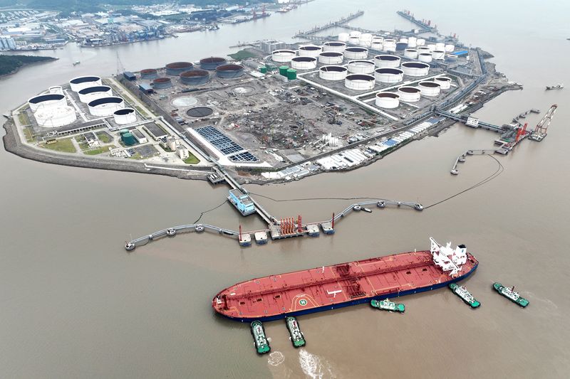 Oil edges up 1% on big US crude withdrawal, China stimulus