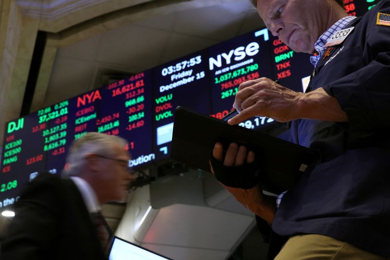 S&P 500 extends streak of record highs; Tesla tumbles