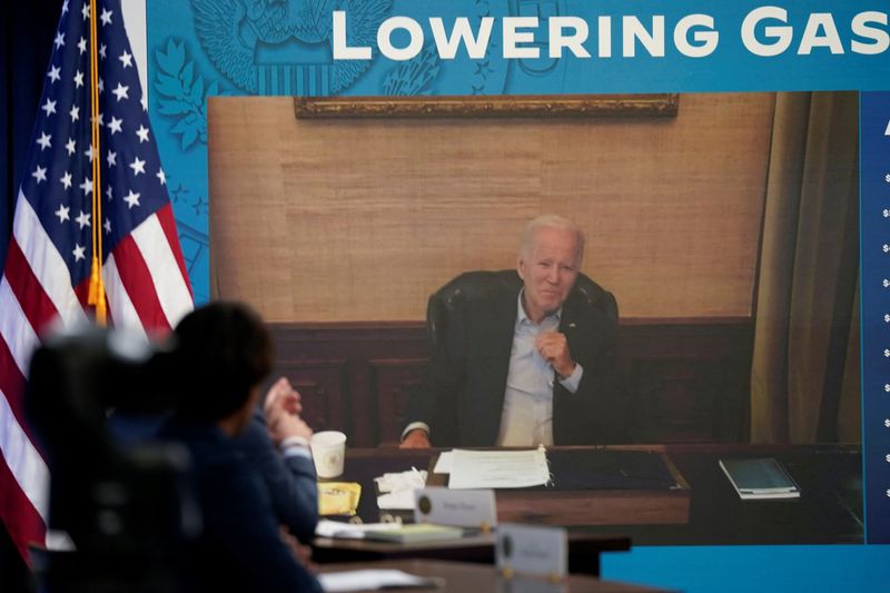 Vigorous but coughing, COVID-postive Biden appears virtually at White House meeting