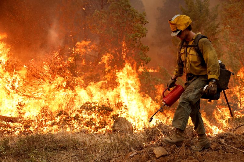 Rain helps California firefighters combat blaze, ends brutal heat wave