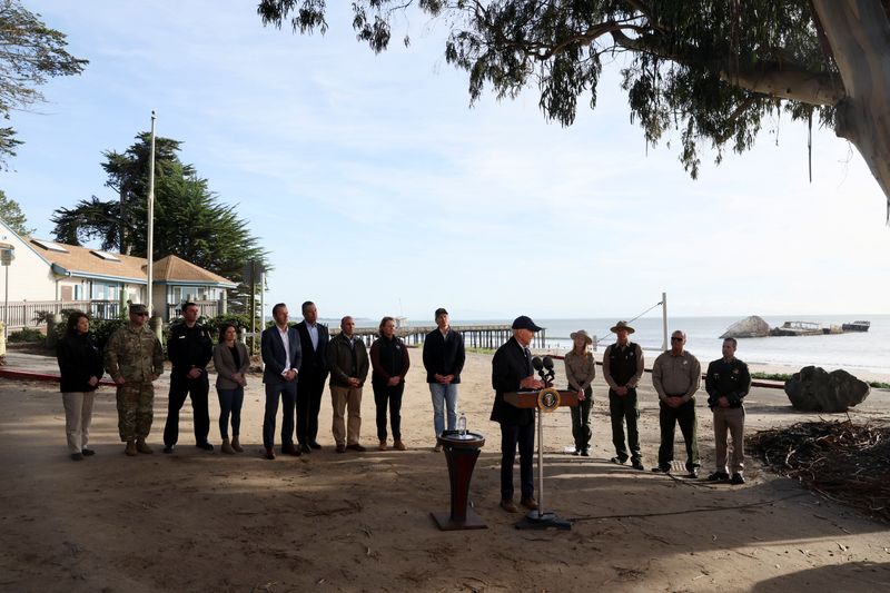 Biden highlights climate change as he tours California areas lashed by storms