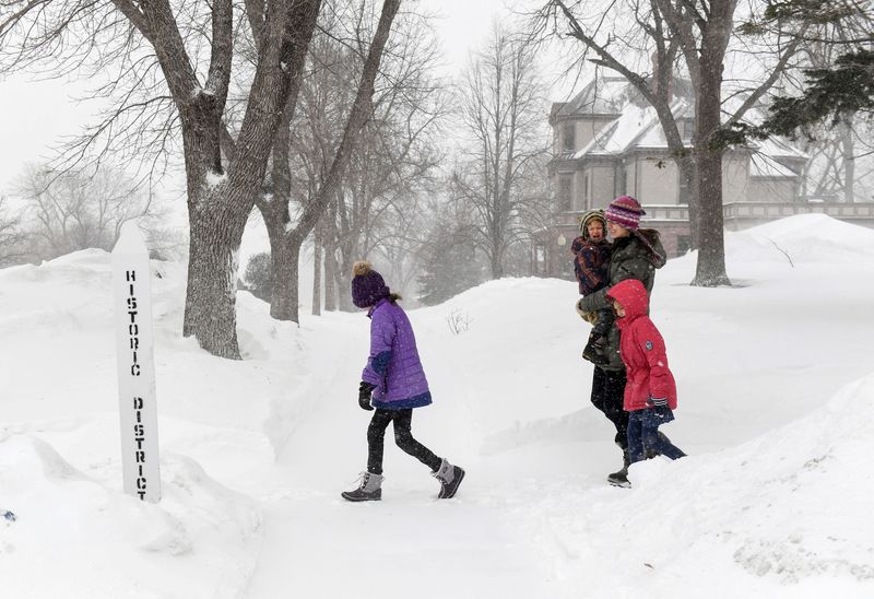 Massive snowstorm closes schools, grounds flights in U.S. heartland
