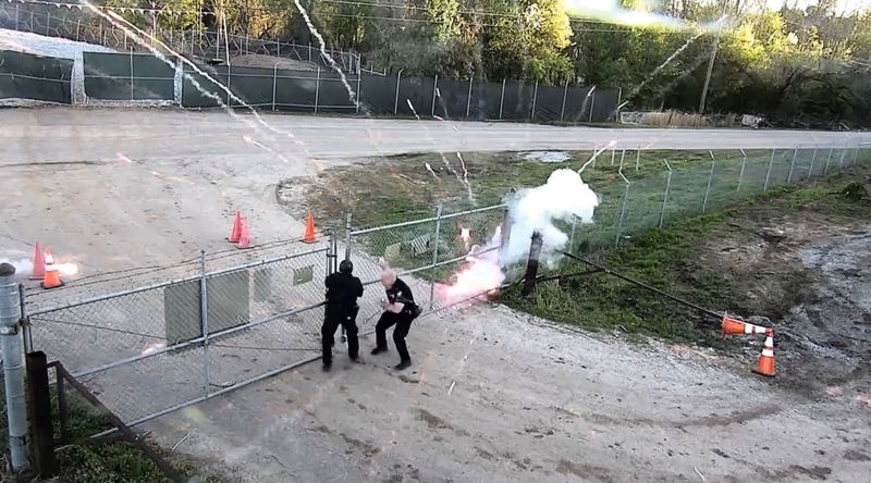 More Than 20 Charged With Domestic Terrorism After Fiery Police Site Attack