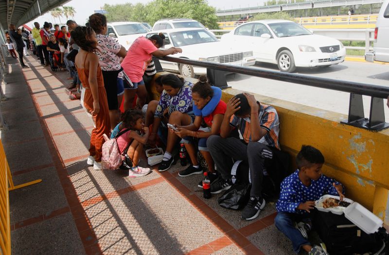 Faced with tougher U.S. policy, migrants in Mexico pin hopes on asylum app
