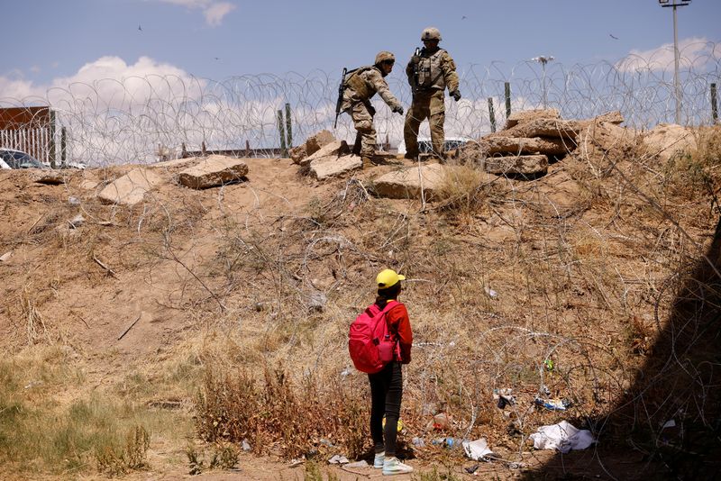 With barbed wire and warnings, migrants stopped at US-Mexico border