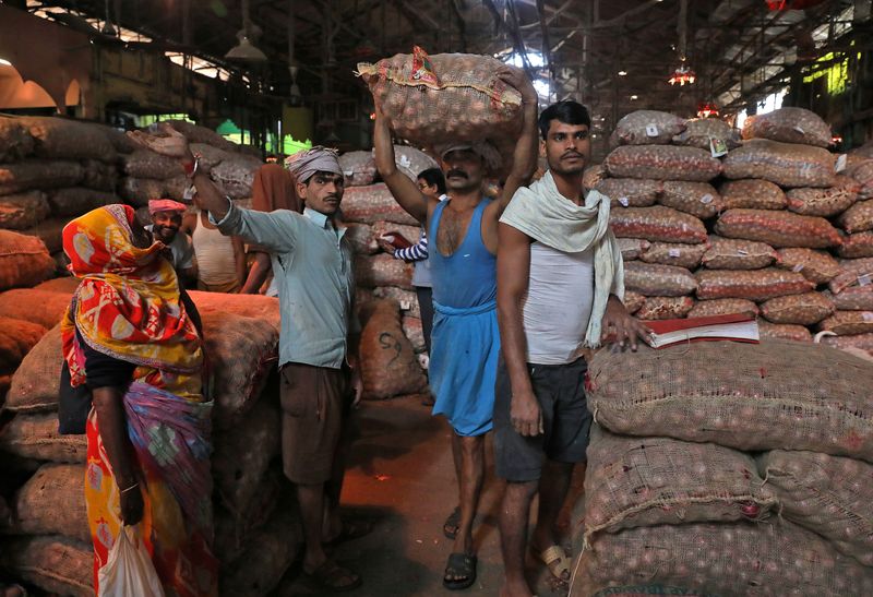 India's July WPI inflation eases to 13.93% y/y