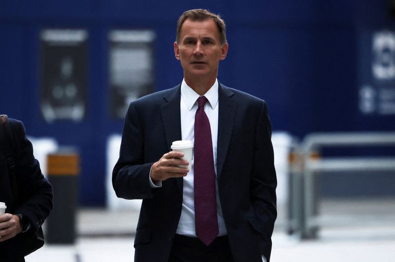 UK's Hunt brings forward fiscal announcement to Monday