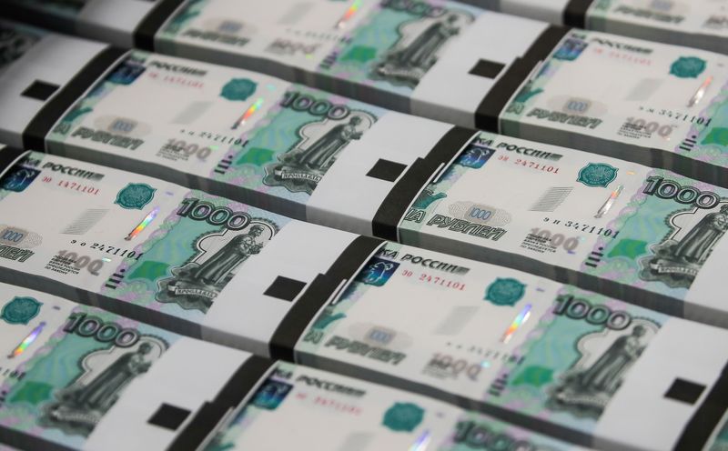 Russian rouble soars to 83 vs dollar before easing, stocks mixed