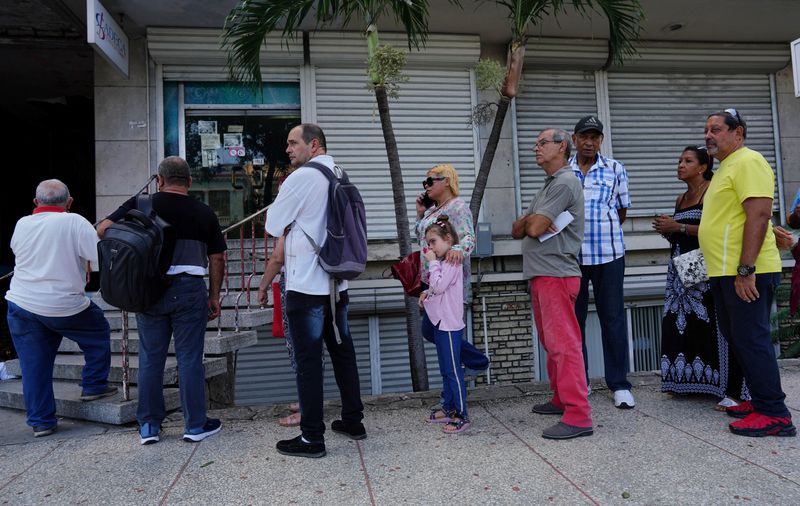 Cubans struggle as peso loses half its value in a year on informal market