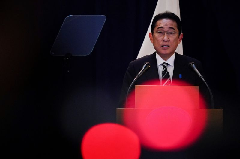 Japan's Kishida vows to focus on wage hikes at union meeting