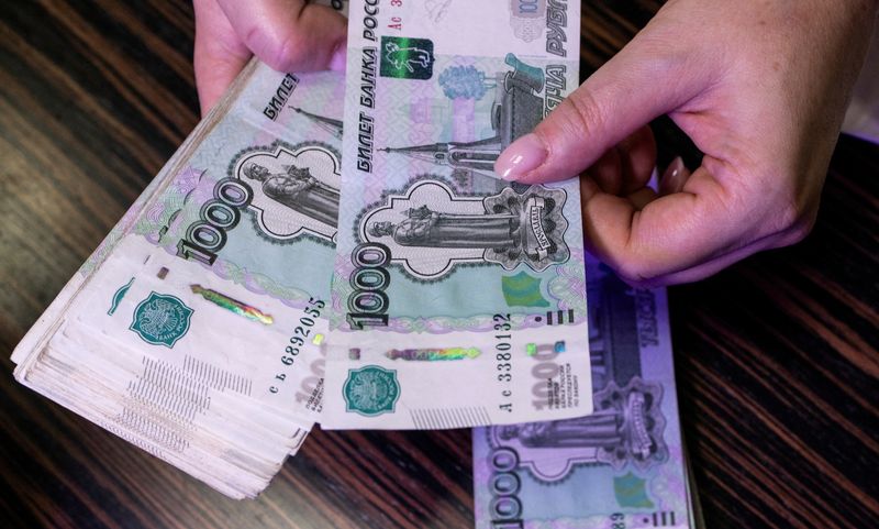 Rouble jumps against dollar after Putin reimposes currency controls