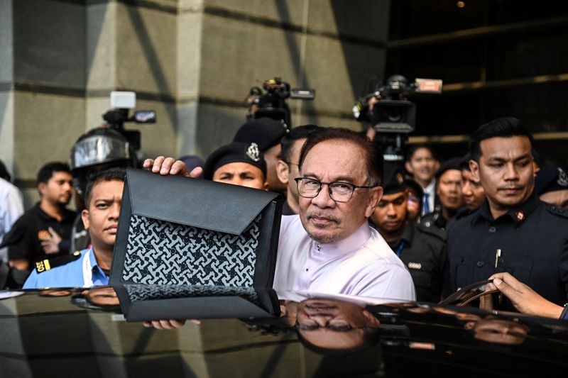 Malaysia announces new taxes, cuts subsidies in tighter 2024 spending plan