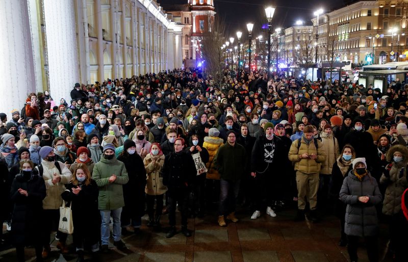 Russia cracks down on home front as its troops invade Ukraine