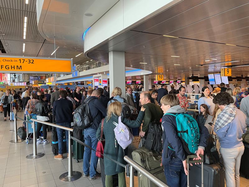 Strike causes chaos at Amsterdam airport as holiday begins
