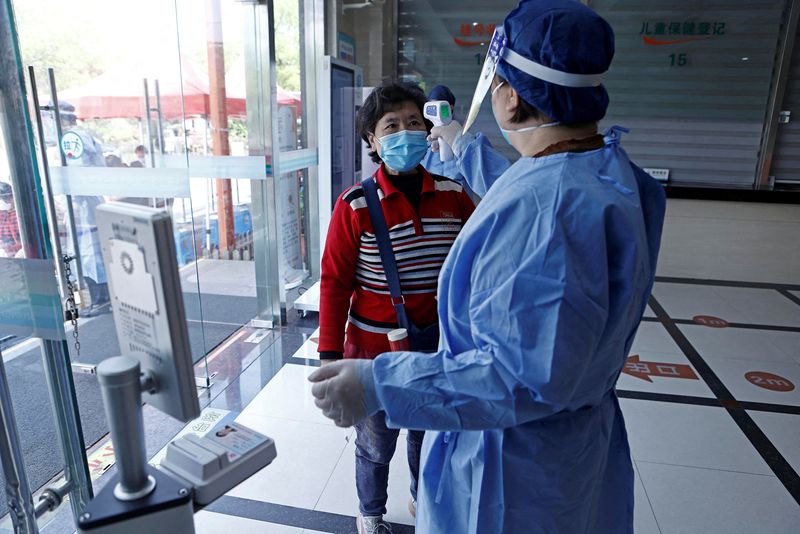 Shanghai says all residents in 'low-risk' areas can return to work on June 1