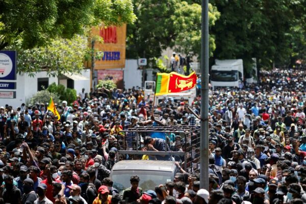 Sri lankans storm prime minister's office, demanding he quit as well