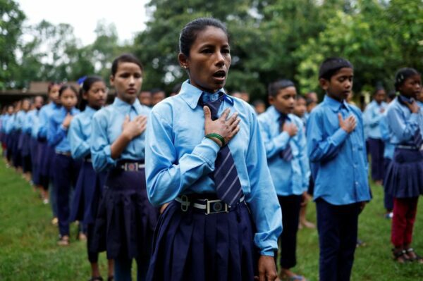 Nepali woman's quest to learn takes her back to school with son