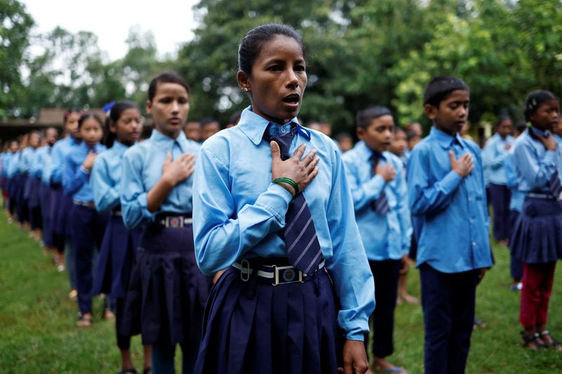 Nepali woman's quest to learn takes her back to school with son