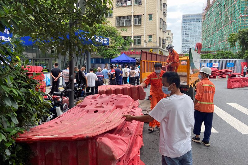 China's Guangzhou, Shenzhen tighten COVID curbs as parts of north join in