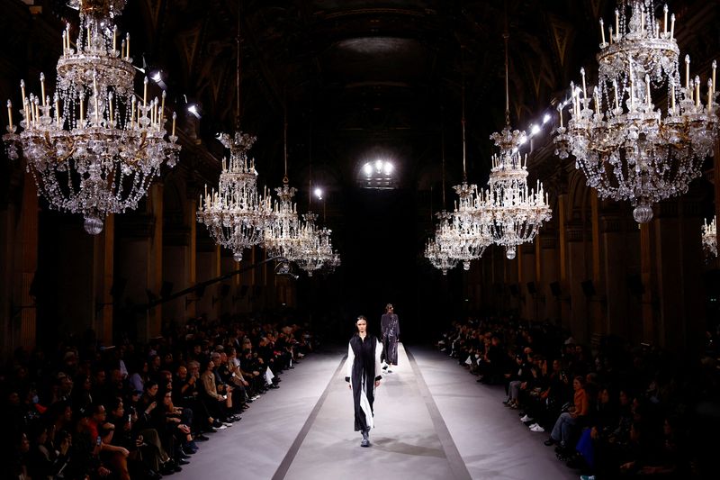 Under a cloud of belt-tightening, Paris Fashion Week struts on