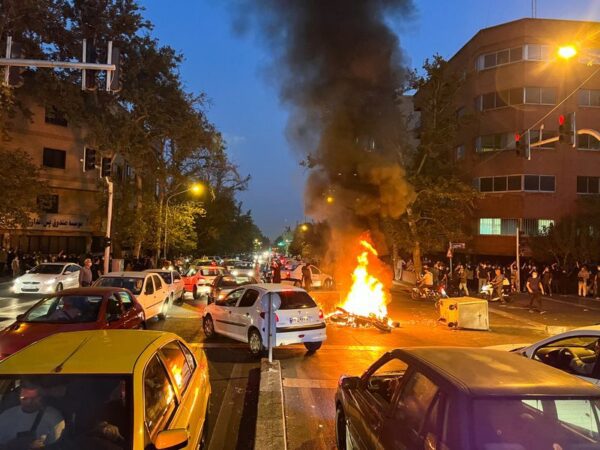 Iran riot police clash with students protesting young woman's death