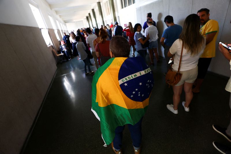 Tensions high as Brazilians on other side of Atlantic cast ballots
