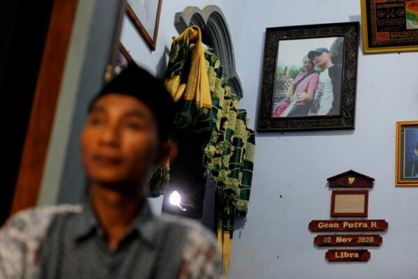 Finding their bodies: indonesian fan's desperate search for family after soccer stampede