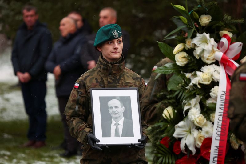 Polish villagers bury man killed in blast near Ukrainian border