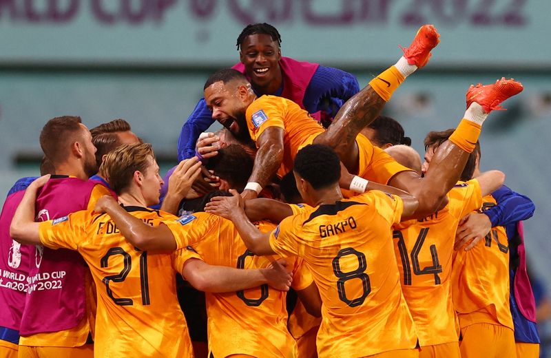 Soccer-Dutch full backs show the way to the quarter-final