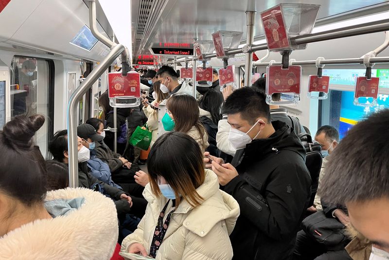 Beijing, Shanghai residents back to work as China limps towards living with COVID