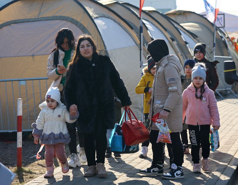 Ukrainian refugees in Poland queue for work permits as border crossings ebb