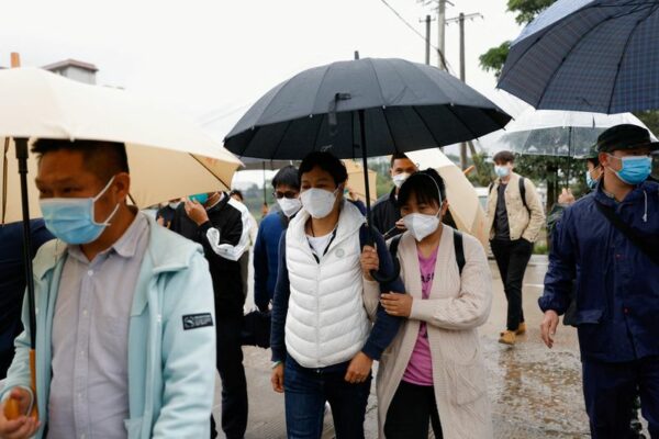 At China plane crash site, relatives wait in grim vigil