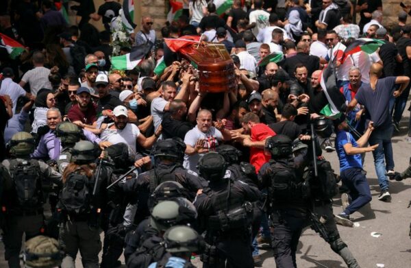 Israeli police beat mourners at funeral of slain palestinian journalist