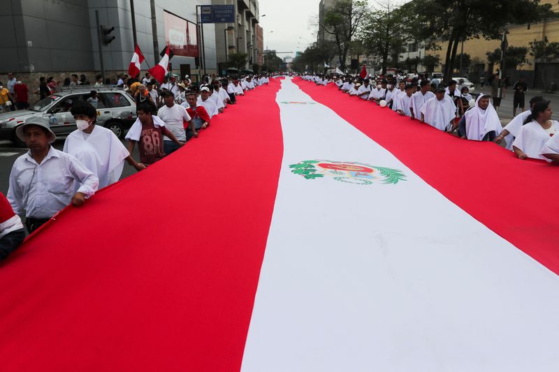 Conservative Peruvian groups march for peace ahead of fresh protests